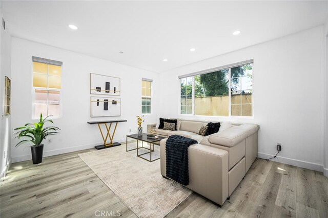 3242 Harmona Pl, Los Alamitos, CA 90720 - living area with recessed lighting, baseboards, and wood finished floors