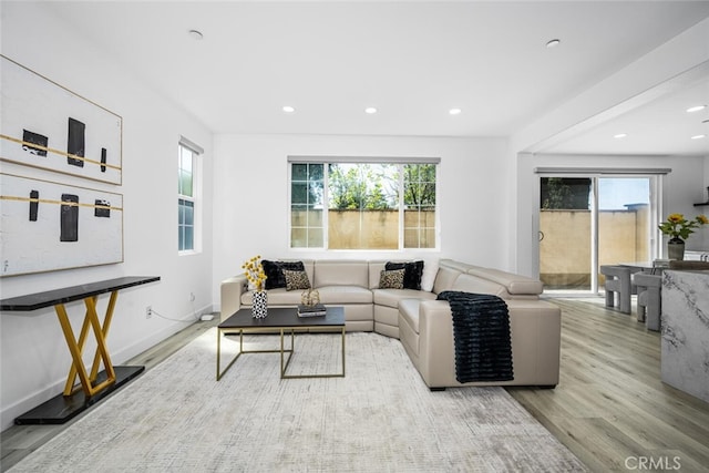 3242 Harmona Pl, Los Alamitos, CA 90720 - living room featuring recessed lighting, wood finished floors, and a healthy amount of sunlight