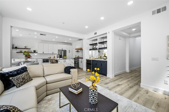 3242 Harmona Pl, Los Alamitos, CA 90720 - living room with recessed lighting, light wood-type flooring, and visible vents