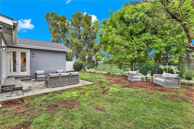 view of yard featuring french doors, an outdoor hangout area, a fenced backyard, and a patio