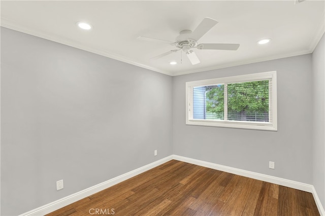 empty room with dark wood finished floors, recessed lighting, a ceiling fan, and baseboards