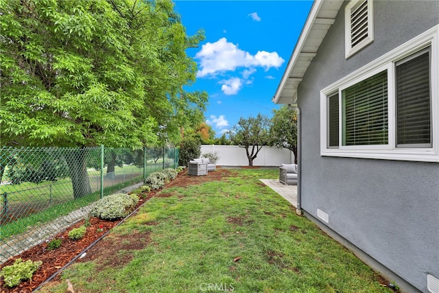 view of yard with a fenced backyard