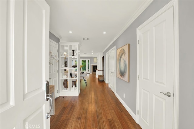 foyer with baseboards, visible vents, recessed lighting, dark wood-style flooring, and crown molding