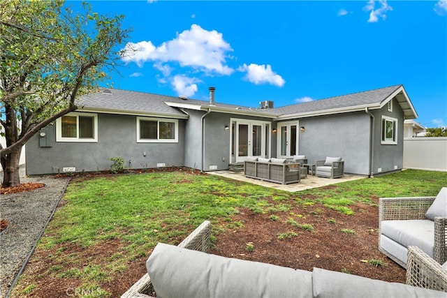 rear view of house with an outdoor living space, french doors, a patio area, and stucco siding