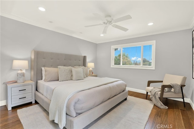 bedroom with dark wood-style floors, recessed lighting, baseboards, and ornamental molding