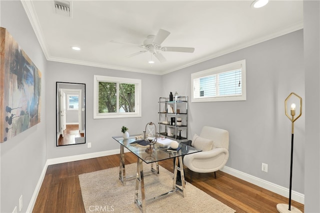 office space with visible vents, baseboards, plenty of natural light, and wood finished floors