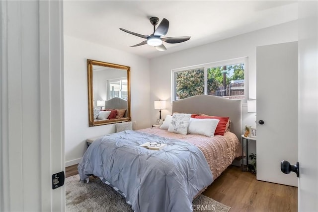 bedroom featuring wood finished floors and ceiling fan