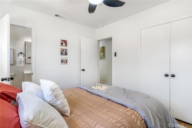 bedroom featuring connected bathroom, a closet, and ceiling fan