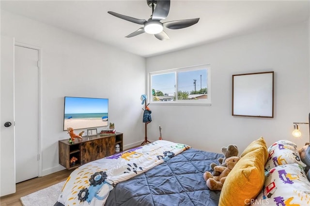 19436 Chaparral St, Rialto, CA 92376 - bedroom with wood finished floors, ceiling fan, and baseboards