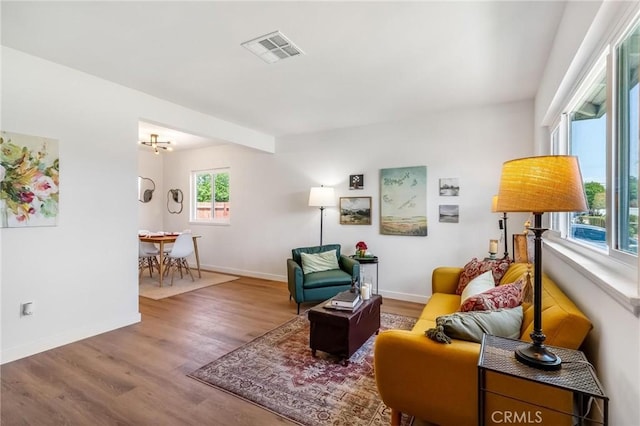 sitting room with wood finished floors and baseboards