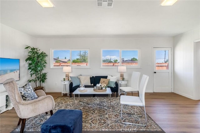 living room featuring wood finished floors and baseboards