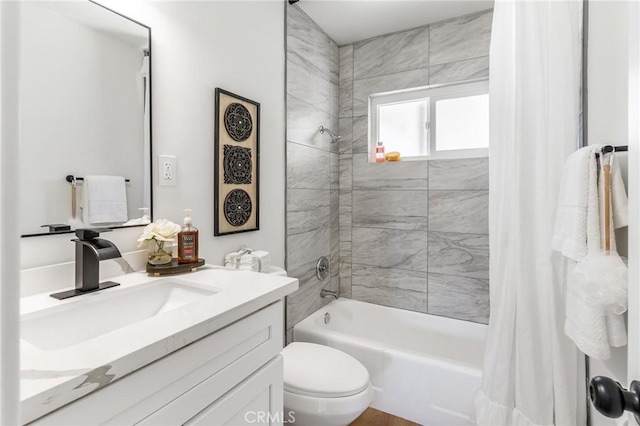 full bath with shower / tub combo with curtain, toilet, and vanity