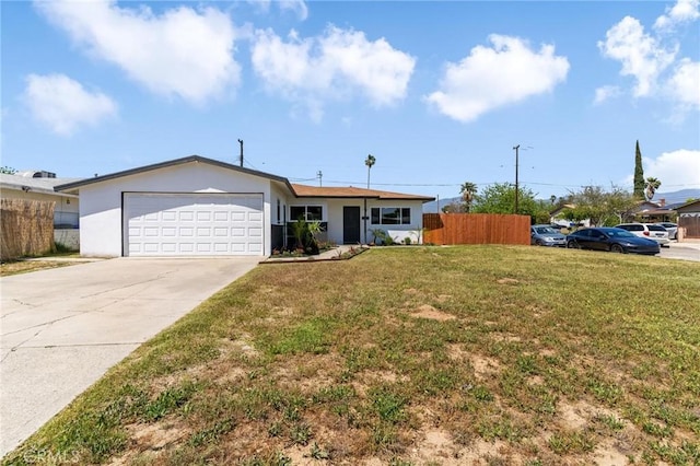 ranch-style house featuring an attached garage, driveway, and stucco siding