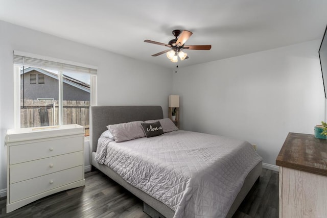 bedroom featuring dark wood-type flooring and a ceiling fan