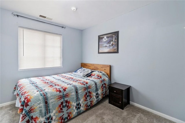 bedroom featuring visible vents, baseboards, and carpet flooring