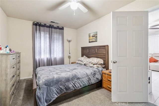 bedroom featuring visible vents, carpet floors, and ceiling fan