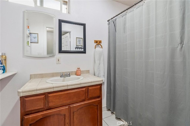 full bath featuring tile patterned flooring and vanity