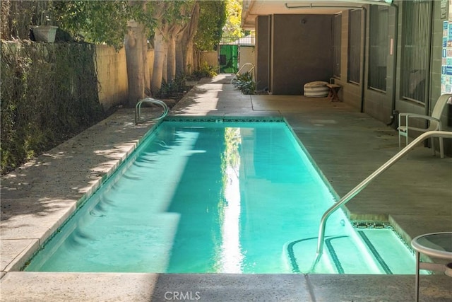 view of pool featuring a fenced in pool and a fenced backyard