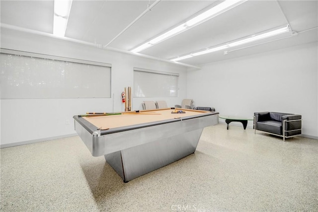 recreation room featuring billiards, baseboards, and speckled floor