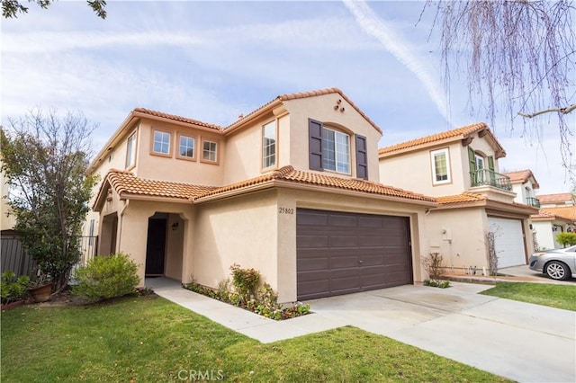 mediterranean / spanish-style home with a tiled roof, stucco siding, driveway, a balcony, and an attached garage