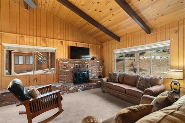 living area with lofted ceiling with beams, wooden ceiling, wood walls, and carpet floors