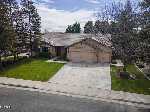 view of front facade featuring a front lawn, a tile roof, concrete driveway, stucco siding, and an attached garage