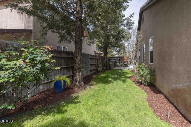 view of yard featuring a fenced backyard