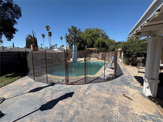 view of swimming pool with a fenced in pool, a patio, and a fenced backyard