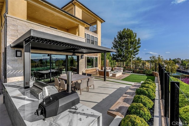 view of patio / terrace with an outdoor living space, a balcony, area for grilling, and fence