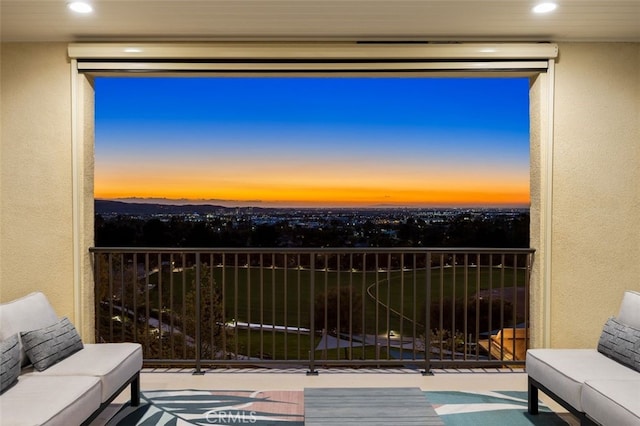 view of balcony at dusk