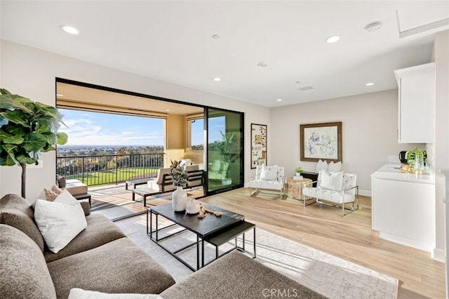 living room with recessed lighting and light wood finished floors