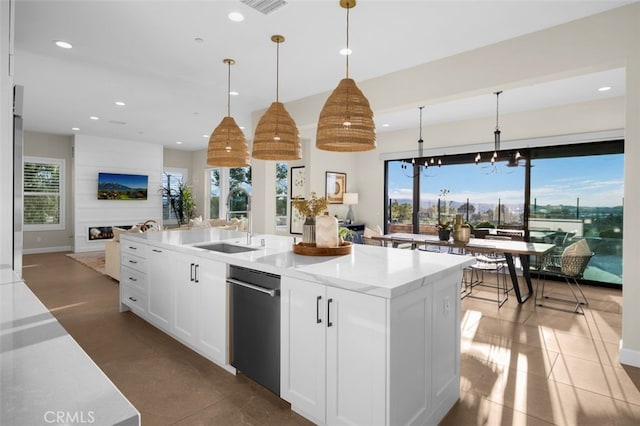 kitchen featuring a sink, plenty of natural light, open floor plan, and recessed lighting