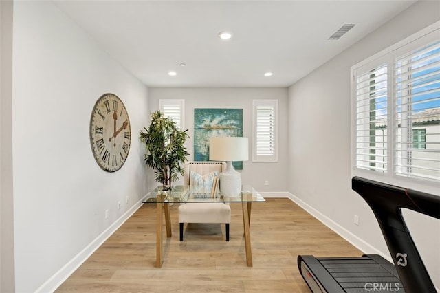 office area featuring light wood finished floors, visible vents, recessed lighting, and baseboards