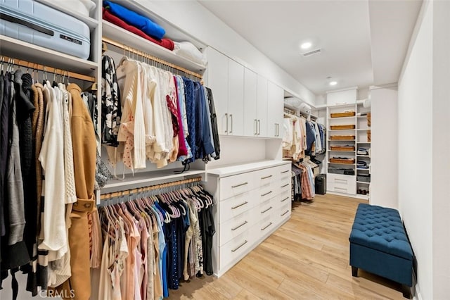 spacious closet featuring visible vents and light wood finished floors