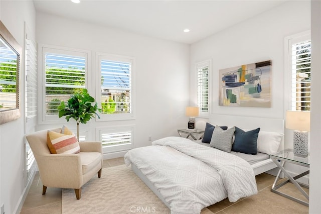 tiled bedroom with recessed lighting