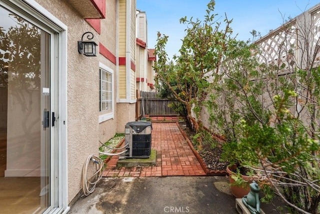 view of patio featuring cooling unit and a fenced backyard