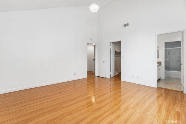 unfurnished bedroom featuring baseboards, visible vents, and light wood-type flooring