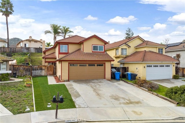 view of front of property with a front yard, fence, driveway, a garage, and a tiled roof