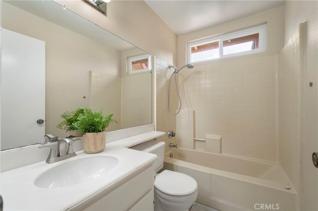 bathroom with vanity, shower / bathing tub combination, and toilet