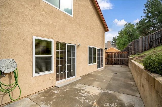 view of patio featuring fence