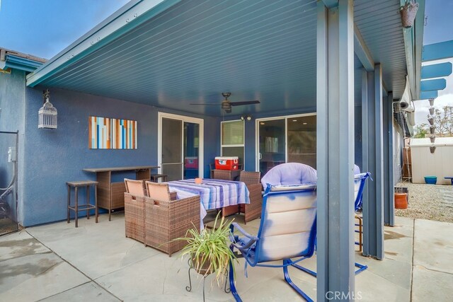 view of patio featuring ceiling fan