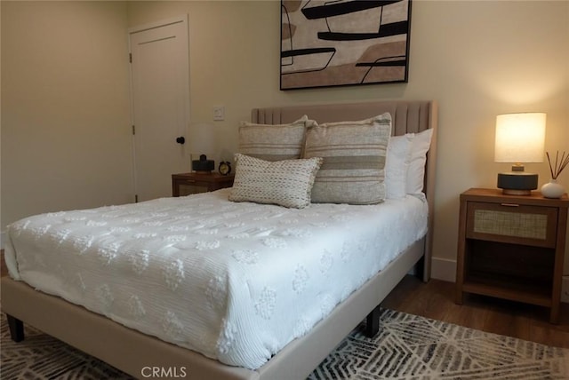 bedroom featuring wood finished floors