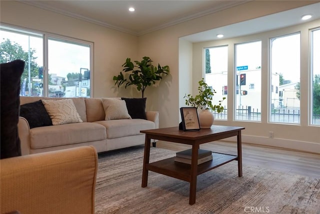 living area featuring recessed lighting, plenty of natural light, and light wood finished floors