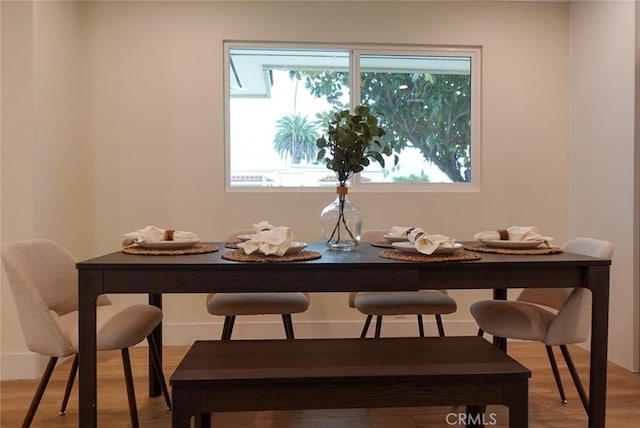 dining area with light wood-type flooring