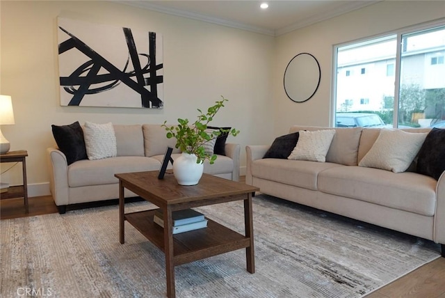 living room featuring recessed lighting, wood finished floors, baseboards, and ornamental molding