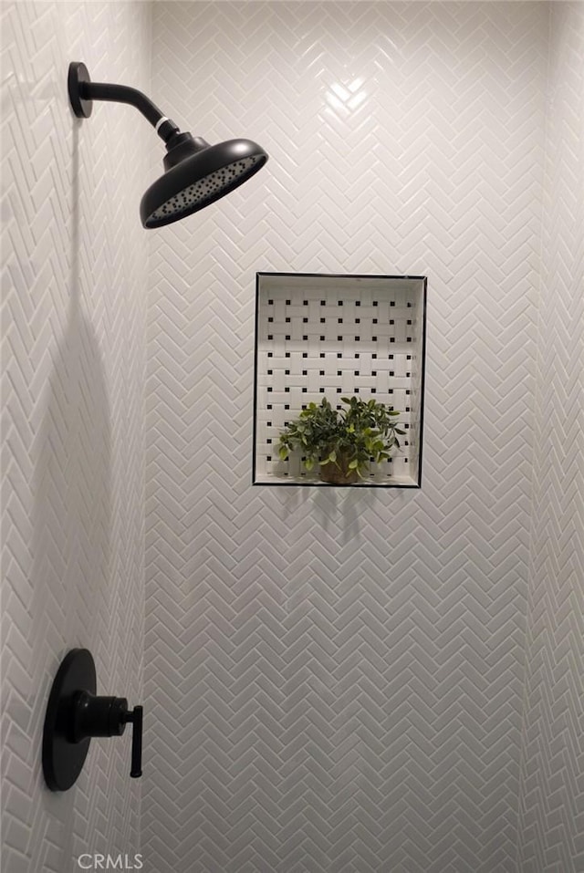 details with a tile shower