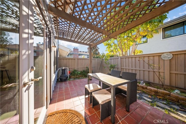 view of patio with a fenced backyard, outdoor dining space, and a pergola