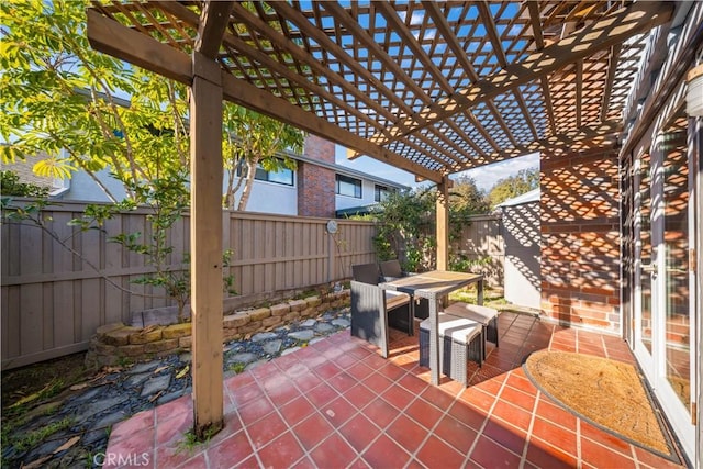 view of patio with outdoor dining space, a pergola, and a fenced backyard