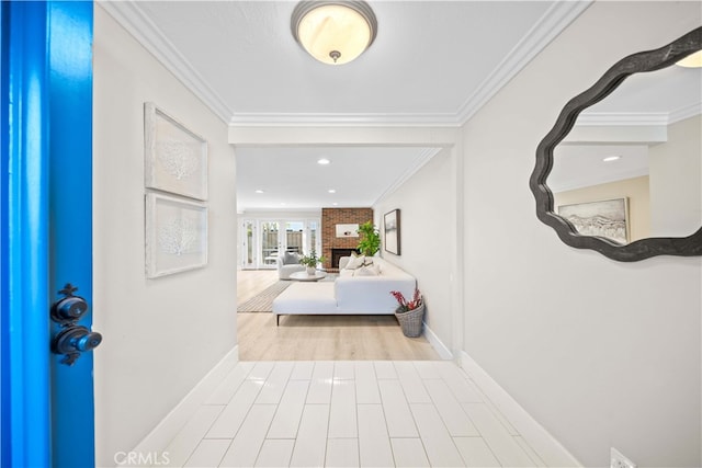 foyer entrance with recessed lighting, wood finished floors, baseboards, and ornamental molding