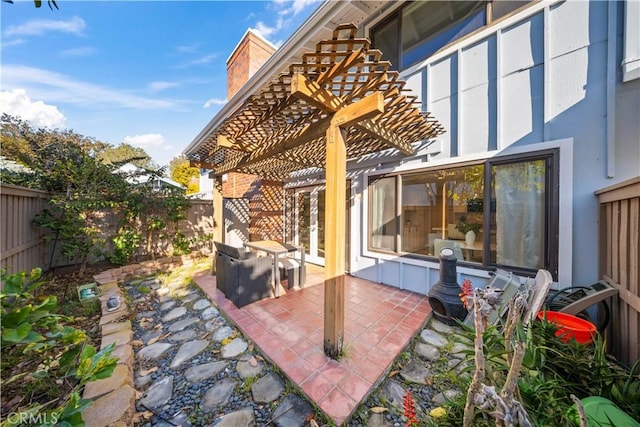 view of patio with a fenced backyard and a pergola